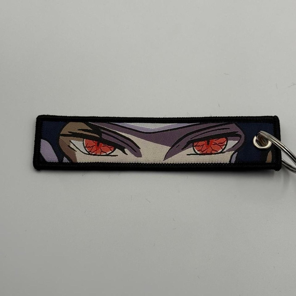 JoJo's Bizarre Adventure Anime Keychain Red Eyes Black Hair Flight Tag